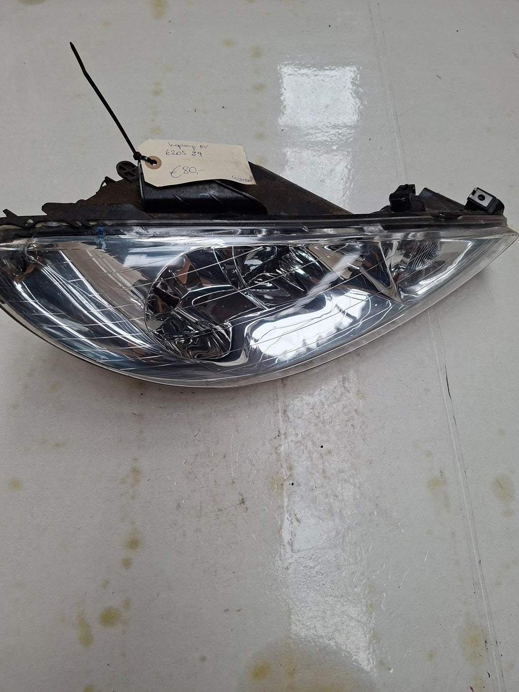 Originele koplamp rechts van een Peugeot 206 (OEM 6205 S9), bouwjaar 2004